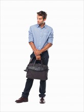 Studio shot of executive holding business bag. Photo: momentimages