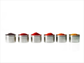 Studio shot of row of jars with spices. Photo: David Arky