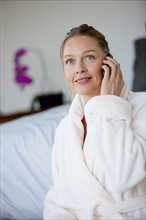 Portrait of mature woman with mobile phone. Photo : Rob Lewine
