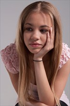 Portrait of teenage girl (16-17), studio shot. Photo: Rob Lewine