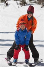 USA, Colorado, Telluride, Mother with son (8-9) skiing together. Photo : db2stock