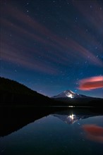 USA, Oregon, Clackamas County, View of Trillium Lake with Mt Hood in background at night. Photo: