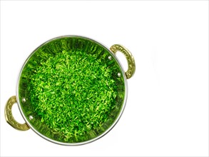 Studio shot of Parsley Flakes in pan on white background. Photo : David Arky