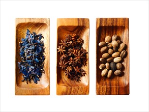 Studio shot of star anise, nutmeg and lavender on wooden trays. Photo: David Arky