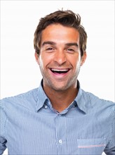 Studio portrait of cheerful business man smiling. Photo : momentimages