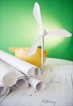 Close up of model of wind turbine and blueprints. Photo : Jamie Grill