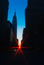 USA, New York, New York City, Silhouette of Empire State Building and street.