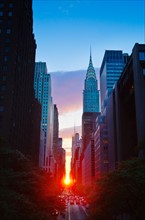 USA, New York, New York City, Chrysler Building and street at sunset.