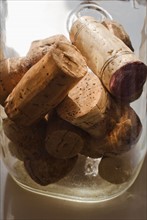 Wine corks in glass jar.