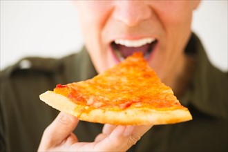 Man eating pizza.