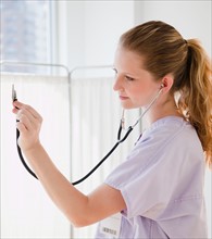 Young nurse with stethoscope. Photo : Jamie Grill