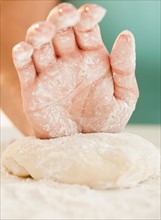 Close up of woman's hand preparing dough. Photo: Jamie Grill