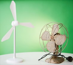 Close up of model of wind turbine and vintage electric fan. Photo : Jamie Grill