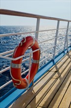 Life belt on ship at sea.