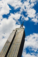 USA, New York, New York City, Empire State Building with cloudy sky.