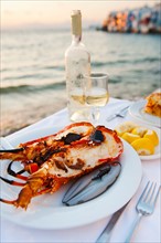 Greece, Cyclades Islands, Mykonos, Lobster dinner at coast.