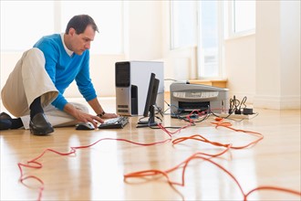 Businessman setting up internet in new office.