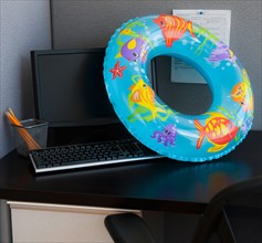 Close up of inflatable ring on office desk. Photo : Daniel Grill
