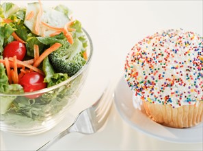 Comparison of cupcake and bowl of salad. Photo: Jamie Grill