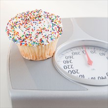 Cupcake on bathroom scale. Photo: Jamie Grill