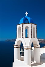 Greece, Cyclades Islands, Santorini, Oia, Church bell tower at coast.