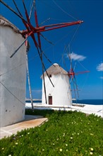 Greece, Cyclades Islands, Mykonos, Old windmills at coast.
