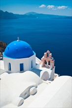 Greece, Cyclades Islands, Santorini, Oia, Church with bell tower at coast.
