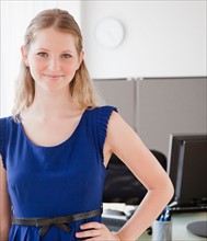 Portrait of young woman in office. Photo : Jamie Grill