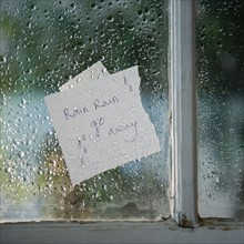 Close up of message on wet window in rainy day. Photo : Jamie Grill