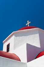 Greece, Cyclades Islands, Mykonos, Church roof with cross.