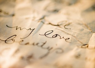 Close up of antique love letter on parchment . Photo: Jamie Grill