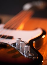 Close up of volume knobs of bass guitar. Photo : Daniel Grill