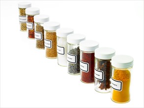Studio shot of Jars with spices on white background. Photo : David Arky