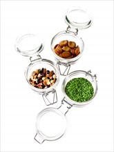 Studio shot of jars with Mixed Seeds on white background. Photo : David Arky