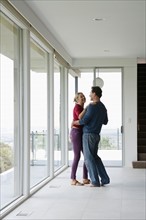 Mature couple dancing in empty living room. Photo : Rob Lewine