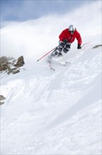 Male skier on fresh powder snow