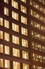 USA, New York State, New York City, Contemporary office building illuminated at night. Photo :