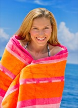 Portrait of woman wrapped in towel.