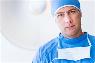 Portrait of male surgeon in operating room.