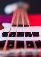 Close up of strings of bass guitar. Photo: Daniel Grill