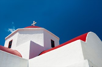 Greece, Cyclades Islands, Mykonos, Church roof with cross.