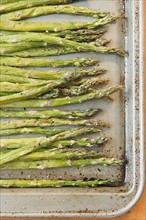 Close up of roasted asparagus on baking sheet. Photo: Jamie Grill