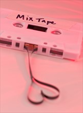 White mix tape with heart shape, studio shot. Photo : Daniel Grill