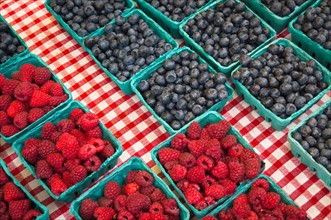 Raspberries and blueberries in cartons. Photo : Gary J Weathers