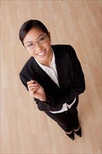 Portrait of young smiling businesswoman. Photo : Rob Lewine