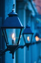 USA, Georgia, Savannah, Close up of gas street lamps at dusk.