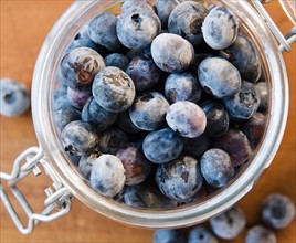 Close up of frozen blueberries in jar. Photo : Jamie Grill