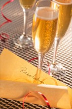 Flutes with champagne and list of resolutions. Photo: Daniel Grill