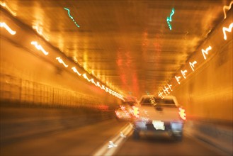 USA, New York State, New York City, Manhattan, Cars in tunnel, blurred motion. Photo: fotog