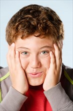 Studio portrait of boy (12-13). Photo: Rob Lewine